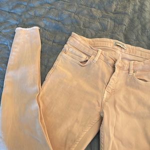 Baby pink skinny jeans